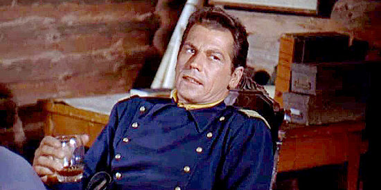 Ron Randall as Capt. Bell, the officer in command of the fort where the stolen rifles disappeared in Quincannon, Frontier Scout (1956)