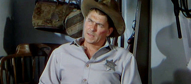 Ronald Reagan as Frame Johnson, trying to reason with younger brother Jimmy in Law and Order (1953)