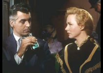 Rory Calhoun as Brett Wade and Piper Laurie as Rannah Hayes meet on a train in Dawn at Socorro (1954)