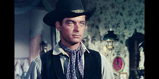 Rory Calhoun as Ray Cully, anticipating a reunion with an old friend in Four Guns to the Border (1954)