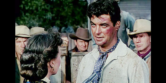 Rory Calhoun as Ray Cully, being invited out of town after a tussle with the sheriff in Four Guns to the Border (1954)