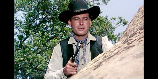 Rory Calhoun as Ray Cully, catching his first glimpse of George Bhumer's pretty daughter in Four Guns to the Border (1954)
