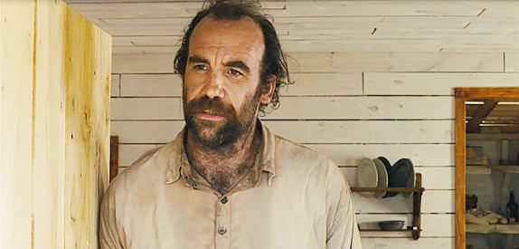 Rory McCann as John Ross, the man who settles in the West with his daughter Rose in Slow West (2015)