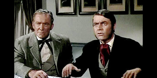 Roy Roberts as Charles de Haven and Dan Riss as George Armstrong arguing for continuing the railroad mail in Wyoming Mail (1950)