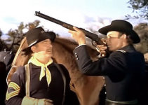Roy Roberts as Sgt. Creever, teaching Dr. Allen Seward (Robert Francis) how to use a rifle in They Rode West (1954)