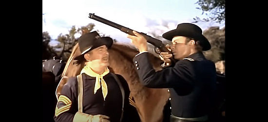 Roy Roberts as Sgt. Creever, teaching Dr. Allen Seward (Robert Francis) how to use a rifle in They Rode West (1954)