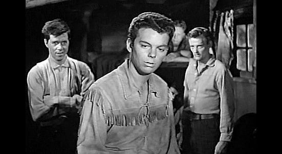 Russ Tamblyn as Tully Rice, making a mark among his new friends in The Young Guns (1956)