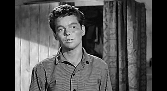 Russ Tamblyn as Tully Rice, trying to live down being the son of a killer in The Young Guns (1956)