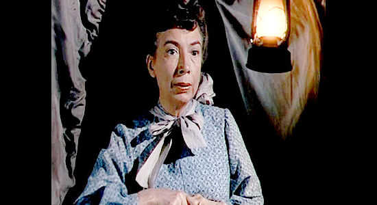 Sara Haden as Elizabeth Cook, unaware of what the men in her family are up to in Wagons West (1952)