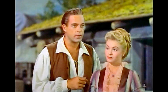 Scott Brady as Jonathan Adams, trying to explain his painting process to Cynthia Stanhope (Lori Nelson) in Mohawk (1956)