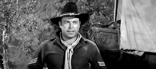 Scott Brady as Sgt. Matt Blake, trying to keep repeating rifles from falling into Apache hands in Ambush at Cimarron Pass (1958)
