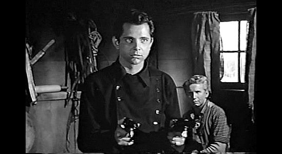 Scott Marlowe as Knox Cutler, stopping a gundown between San Antone and Tully Rice in The Young Guns (1956)