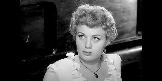 Shelley Winters as Lola Manners, a saloon girl kicked out of Dodge on a town holiday in Winchester '73 (1950)
