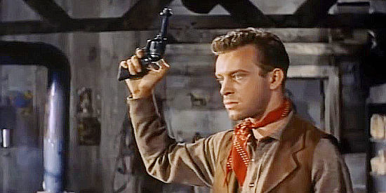 Skip Homeier as Bob Dennis, an outlaw determined to avenge the death of his brother in At Gunpoint (1955)