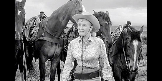 Sue George as Marigold Dalton, pleading with her sisters to stop arguing with one another in The Dalton Girls (1957)