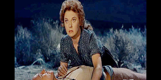 Susan Hayward as Gabrielle Dauphin, reacting to the shooting of her husband Andre in Thunder in the Sun (1959)