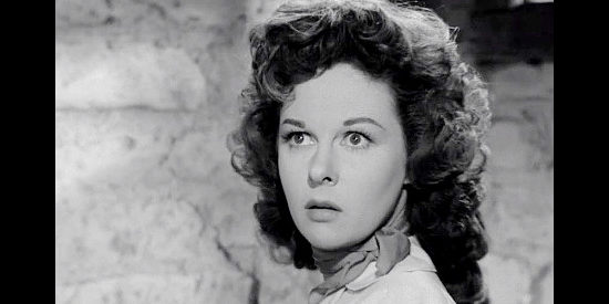 Susan Hayward as Vinnie Holt, alarmed by the predicament she finds herself in at Rawhide Station in Rawhide (1951)