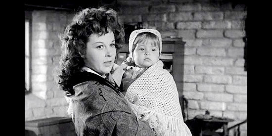 Susan Hayward as Vinnie Holt with Callie (Judy Dunn), the niece she's caring for in Rawhide (1951)