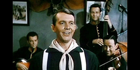 Terry Gilkyson as Singalong, performing at a fort dance in Slaughter Trail (1951)