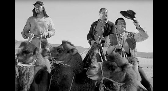 The Arabs -- Kafan (John Doucette), Ghazili (George Tobias) and Hassan (Anthony Caruso) -- on their camels in Desert Pursuit (1952)