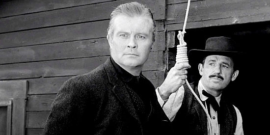 Tom Brown as Sonny Glenn, facing a hangman's noose over a supposedly crooked card game in Naked Gun (1956)