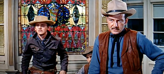 Tom Drake as Abe McQuown, coming face o face with Blaisdell while Billy Gannon looks on in Warlock (1959)