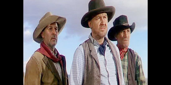 Tom Tully (center) as Ransom, Richard Lavery's loyal foreman, flanked by two of the other ranch hands in Branded (1950)