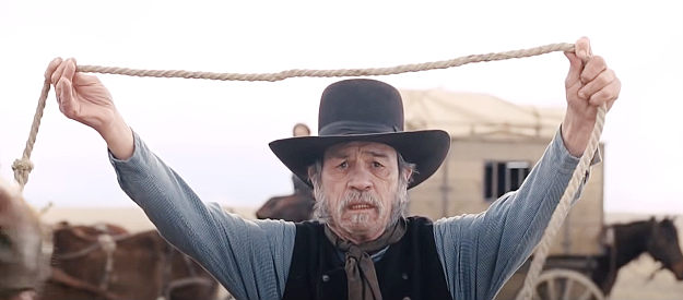 Tommy Lee Jones as George Briggs, offering the Indians a horse for safe passage in The Homesman (2014)