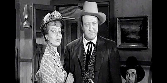 Tracey Roberts as Helen McBridge and Roy Engel as her husband Tom, upset because Sylvia has bought up all the debt on their newspaper in Frontier Gambler (1956)