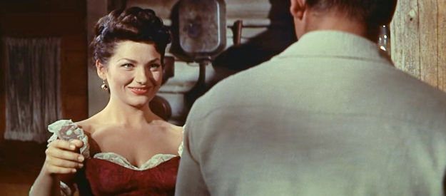 Valerie French as Mae, preparing to dance with Jubal at her husband's insistence in Jubal (1956)