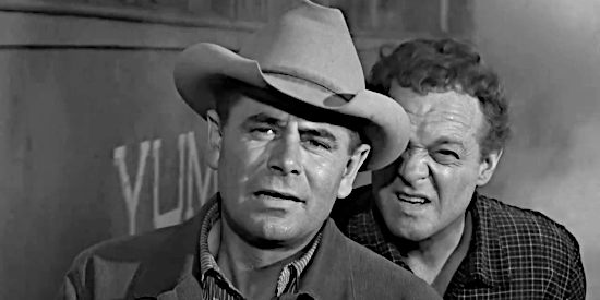 Van Heflin (right) as Dan Evans, trying to get outlaw Ben Wade (Glenn Ford) aboard a train in 310 to Yuma (1957)