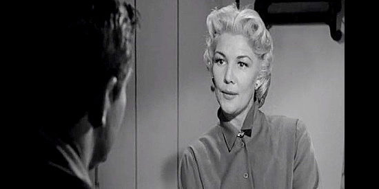 Veda Ann Borg as Francie Merritt, the ranch owner who hired Tony and planned to marry him, until he fell for Sylvia in Frontier Gambler (1956)