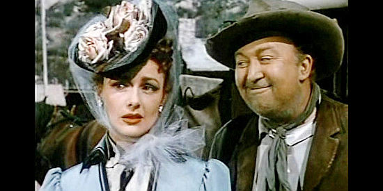 Virginia Grey as Lorabelle Larkin, getting advice on handling the captain from stagecoach driver Matt Magroot (Ralph Peters) in Slaughter Trail (1951)