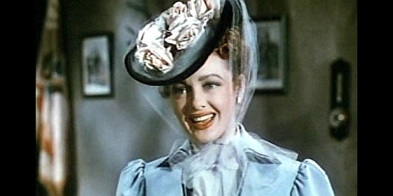 Virginia Grey as Lorabelle Larkin, trying to charm Capt. Dempster into getting her way in Slaughter Trail (1951)