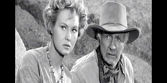 Virginia Mayo as Ann Keith and Walter Brennan as her dad Pop Keith, watching for a chance to slip away in Along the Great Divide (1951)