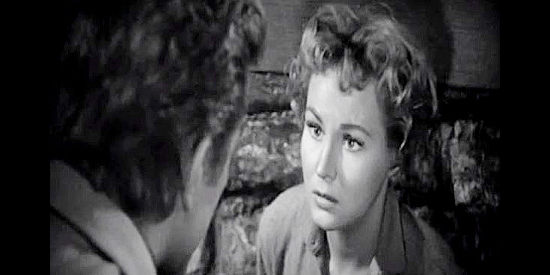 Virginia Mayo as Ann Keith, pleading with Len Merrick on behalf of her father in Along the Great Divide (1951)