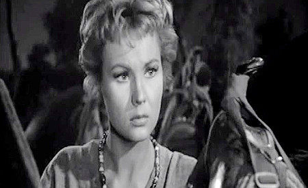 Virginia Mayo as Ann Keith, wondering about the weakness her dad says he's found in Len Merrick in Along the Great Divide (1951)