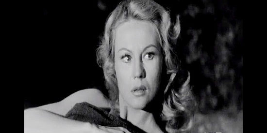 Virginia Mayo as Celia Gray, wondering about the man who just saved her from drowning in Fort Dobbs (1958)