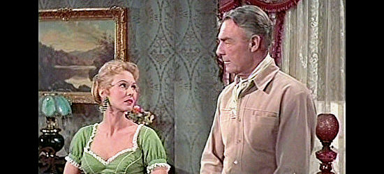 Virginia Mayor as Norma Putnam and Randolph Scott as John Hayes discuss old times in Westbound (1959)