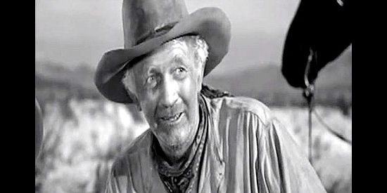 Walter Brennan as Pop Keith, wondering how long Len Merrick can go without sleep in Along the Great Divide (1951)