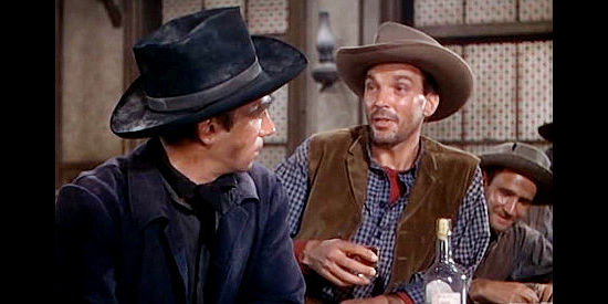 Walter Coy as Benson, Kruger's foreman, recruiting Bob Peters to work in the mine in Barricade (1950)