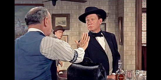 Wendell Corey as Jesse James, frightening a bartender by his mere presence in Alias Jesse James (1959)