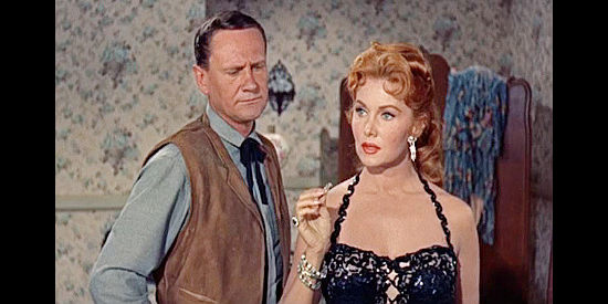 Wendell Corey as Jesse James presenting an engagement ring to Cora Lee Collins (Rhonda Fleming) in Alias Jesse James (1959)