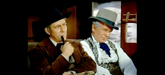 Whit Bissell as Mark Chester and Regis Toomey as Minstrel, stage passengers bound for Indian trouble in Dakota Incident (1956)