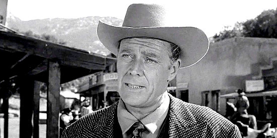 Willard Parker as Breen Mathews, the man who promises to get the Salazar Treasure to the family's last heir in Naked Gun (1956)