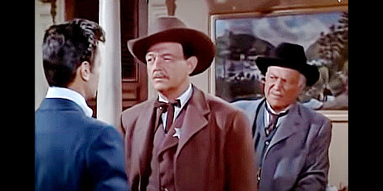 William Gargan as Marshal Sommers and Minor Watson as Matt Comfort, scolding Ben Matthews for his role in a crooked card game in The Rawhide Years (1956)