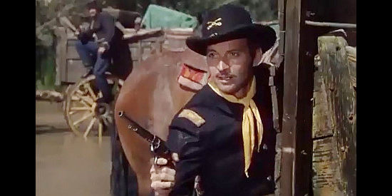 Zachary Scott as Charlie Burns, donning Union blue to run guns to the South in South of St. Louis (1949)