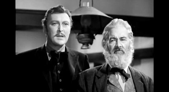 Albert Dekker as Duke Lassiter and Gabby Hayes as Windy Gibson, arguing opposing views in a court case in Wyoming (1947)