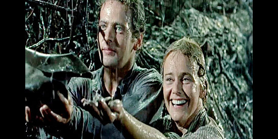 Ben Piazza as Rune and Maria Schell as Elizabeth Mahler find a reason to rejoice in The Hanging Tree (1959)