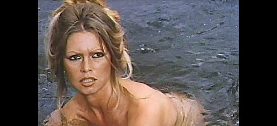 Brigitte Bardot as Louise, surprised while bathing in The Legend of Frenchie King (1971)